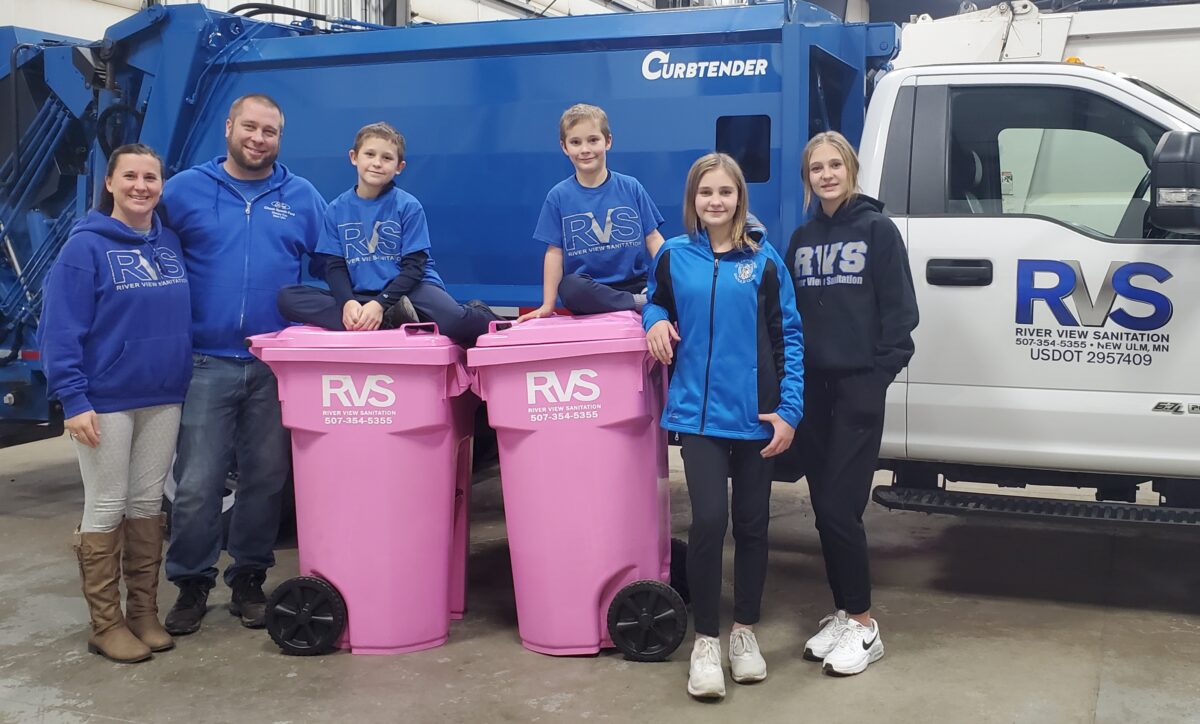 RVS Family standing by Breast Cancer Awareness Bins